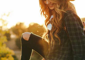 woman waering black blouse and hat