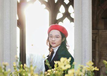 a woman wearing a red hat and glasses