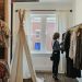 woman standing selecting clothes
