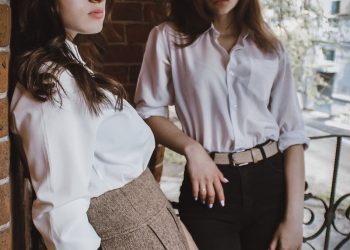 woman in white dress shirt and black skirt