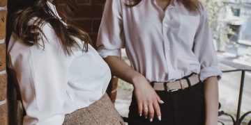 woman in white dress shirt and black skirt